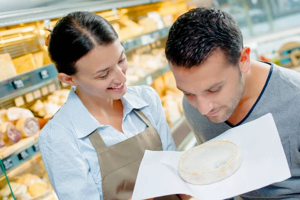 Customer Smelling Cheese — Stock Photo, Image