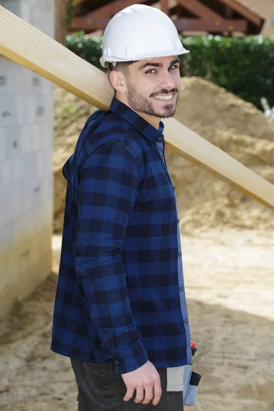 Portrait Young Carpenter Carrying Wooden Plank His Shoulder — Stock Photo, Image