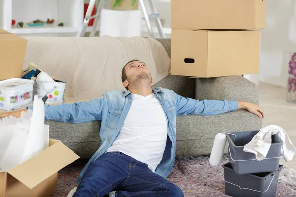 Tired Man Sitting Couch Cardboard Boxes — Stock Photo, Image