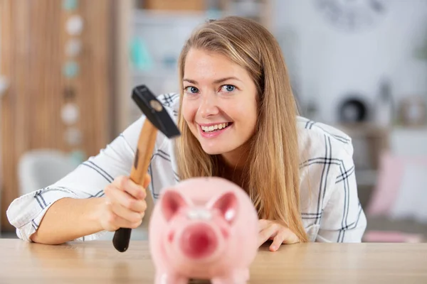 Cheeky Woman Holding Hammer Her Piggybank — Stock Photo, Image