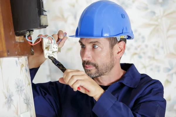 Male Electrician Cutting Cable Old Electricity Meter — Stock Photo, Image