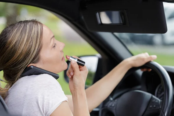 Woman Looking Rear View Mirror Applying Lipstick — Stock Photo, Image