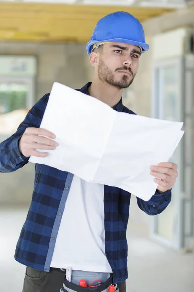 Male Architect Reviewing Blueprint Construction Site — Stock Photo, Image