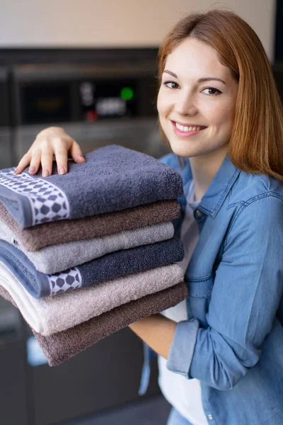 Heerful Young Lady Holds Stack Folded Towels — Stock Photo, Image