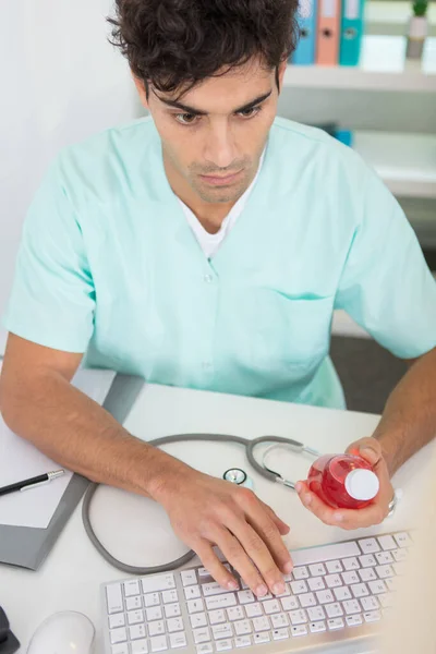 Young Male Doctor Writing Prescription Computer — Stock Photo, Image