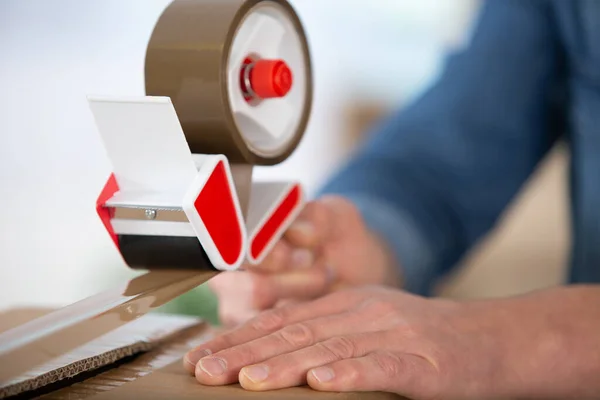 Closeup Tape Measure Seal Cardboard Box — Stock Photo, Image