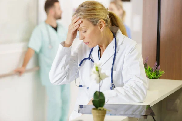 Mature Female Doctor Suffering Headache Stethoscope — Stock Photo, Image