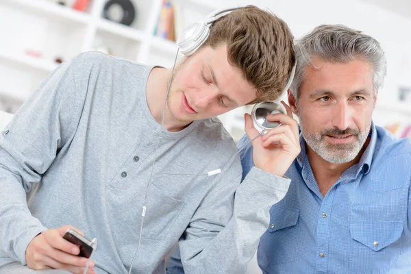 Men Sharing Music Same Headset — Stock Photo, Image