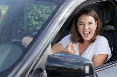 triumphant lady driver and woman clipart