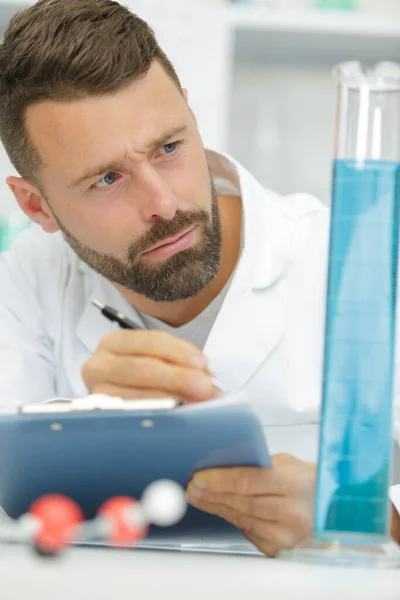 Scientist Examining Jar Liquid Sample — Stock Photo, Image