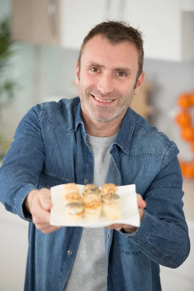 Man Offering Pastry Appetizers — Stockfoto
