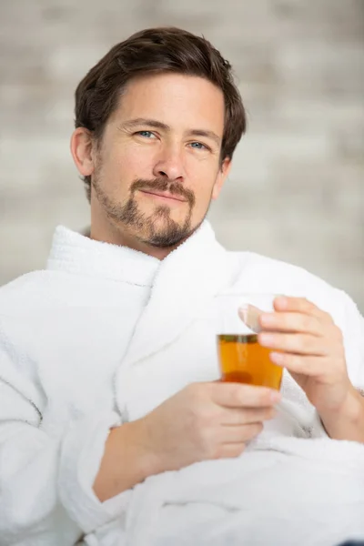 Young Man Bathrobe Holding Cup — Stock Photo, Image