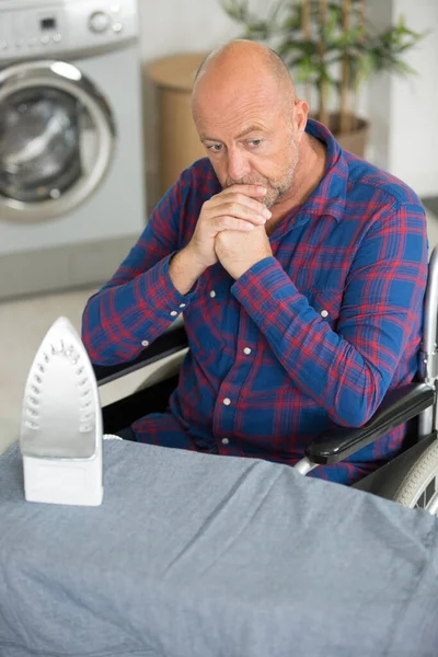 Worried Disabled Man Sitting Wheelchair Ironing — Stock Photo, Image