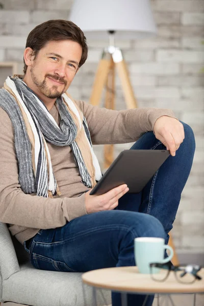 Young Man Relaxing Sofa Using Tablet Computer — Stock Photo, Image