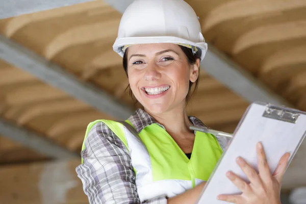 Woman Builder Holding Blueprints — Fotografia de Stock