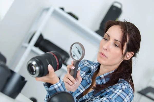 Female Camera Technician Looking Lens Magnifying Glass — Stock Photo, Image