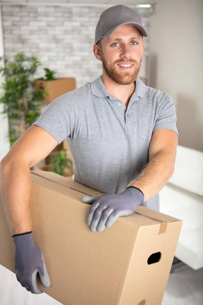 Happy Delivery Man Carrying Cardboard Box — Stock Photo, Image