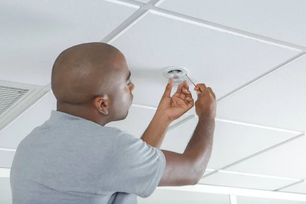 Mid Adult Man Fixing Light Bulb Wiring New House — Stock Photo, Image