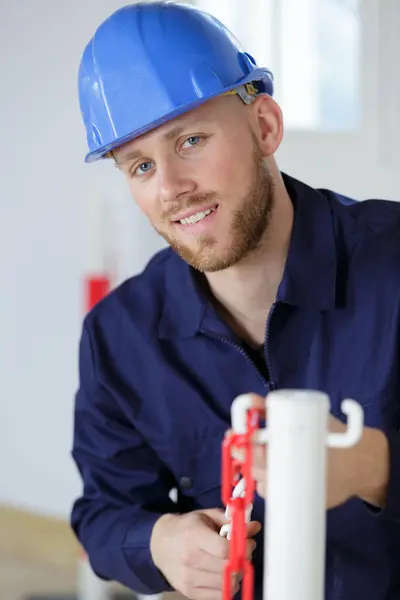 Male Worker Putting Red White Striped Safety Chain — Stock Photo, Image