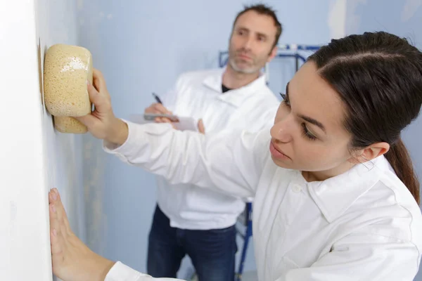 Young Friendly Female Worker Cleaning Wall Painting — Stock Photo, Image