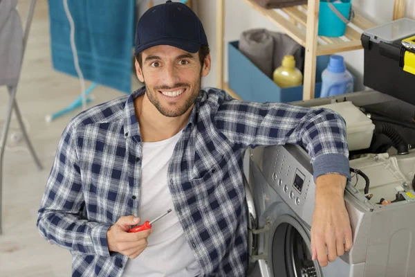 Working Man Plumber Repairs Washing Machine Laundry — Stock Photo, Image