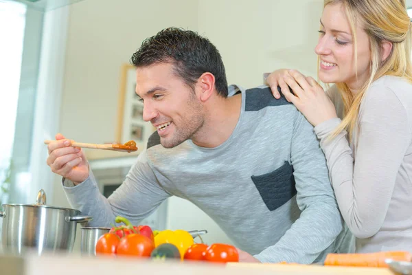 His Wife Teasing Him While Cooking — Stock Photo, Image