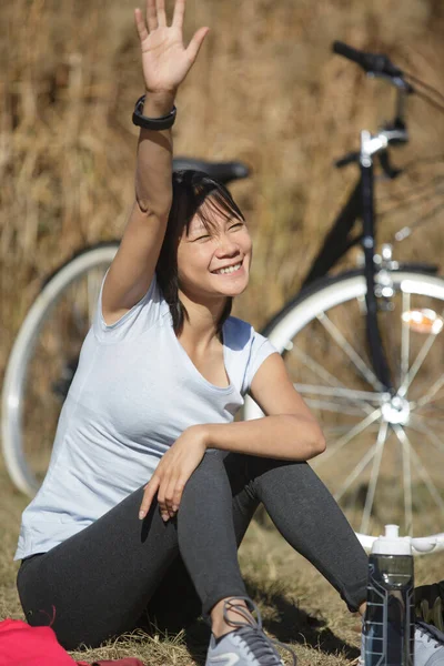 Beautiful Young Woman Waving Next Bicycle Outdoors — Stock Photo, Image