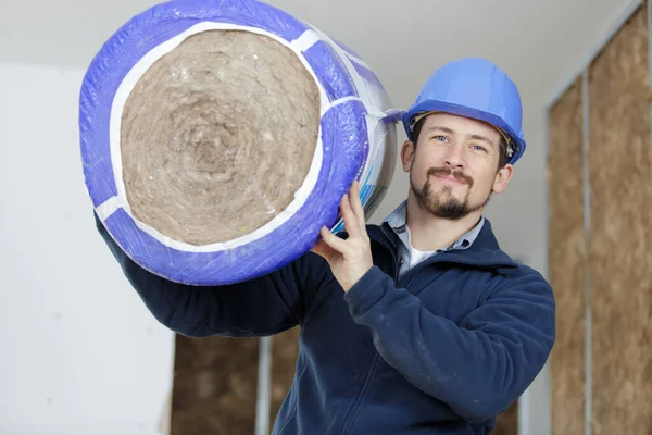 Workman Carrying Roll Insulation — Stock Photo, Image