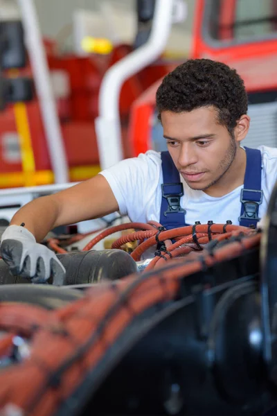 Young Male Mechanic Working Fire Engine — Stock Photo, Image