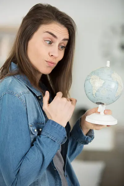 Contemplative Woman Holding Globe — Stock Photo, Image