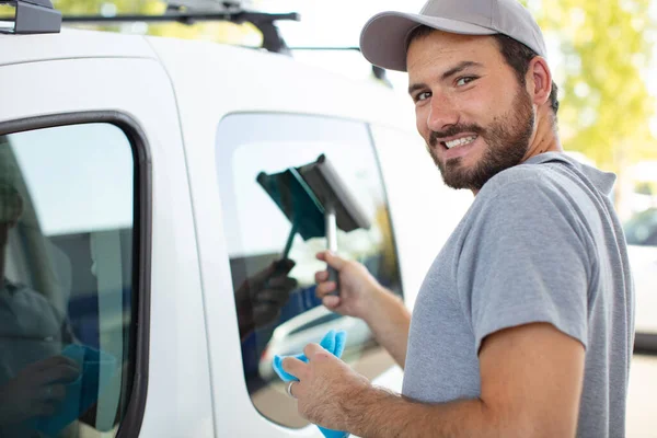 Smiling Young Worker Polishing His Car Cloth — Stock Photo, Image