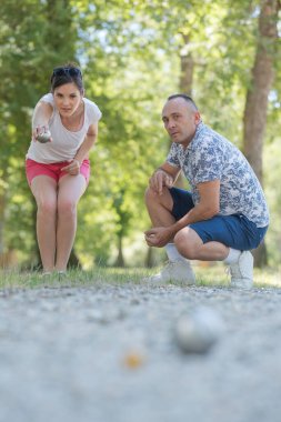 a couple playing the petanque clipart