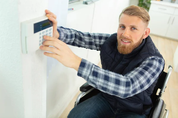 Disabled Male Electrician Installing Security System Door Sensor Wall — Stock Photo, Image