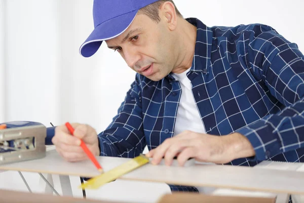 Worker Drawing Line Laminate — Stock Photo, Image