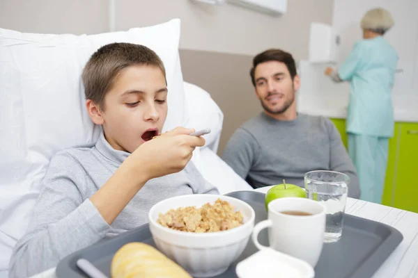 Boy Breakfast Bed Hospital His Father — Stock Photo, Image