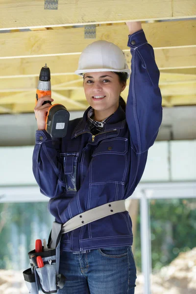 Woman Helmet Fixes Clapboard Ceiling Home — Stock Photo, Image