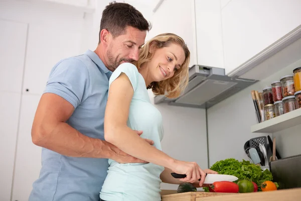 Young Married Couple Embraces Standing Table Kitchen — 스톡 사진