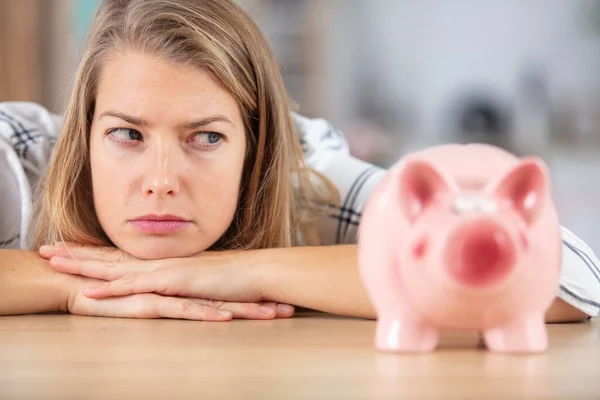 Woman Looking Sideways Her Piggybank — Stock Photo, Image