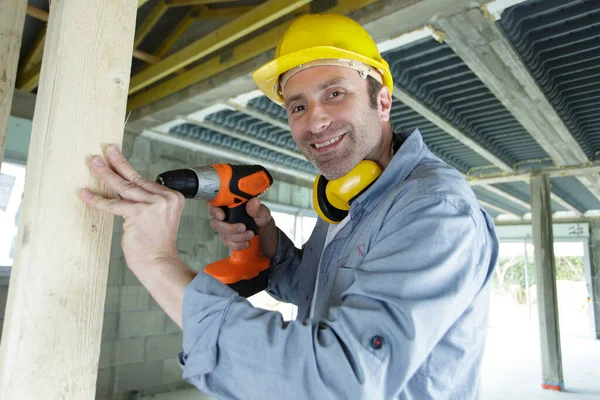 Happy Builder Drilling Indoors — Stock Photo, Image