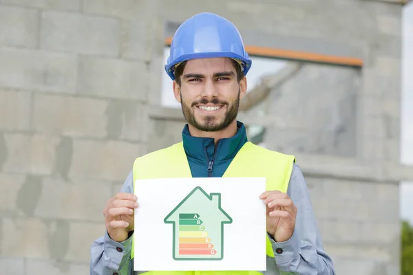 Byggaren Visar Energieffektivitetstabell — Stockfoto