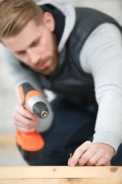 Midsection Man Drilling Nail Table — Stock Photo, Image