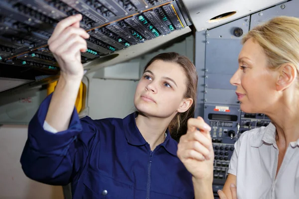 Young Woman Airplane Pilot Checkin Some Digits — Stock Photo, Image