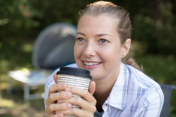 Dreamy Female Camper Holding Drink — Stock Photo, Image