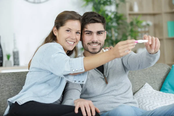 Happy Young Woman Holds Positive Pregnancy Test — Stock Photo, Image