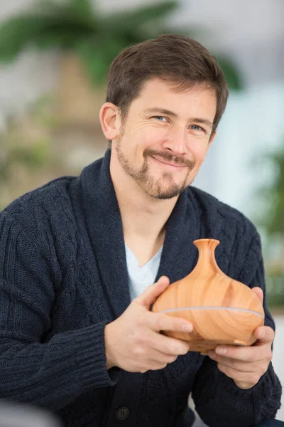 Smiling Man Holding Diffuser Essential Oils — Stock Photo, Image