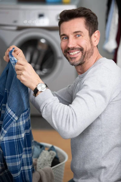 Man Holding Dirty Shirt — Stock Photo, Image