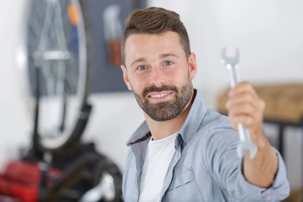 Happy Man Showing Spanner — Stock Photo, Image