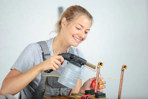 Happy Female Worker Using Blowtorch Copper Pipe — Stock Photo, Image
