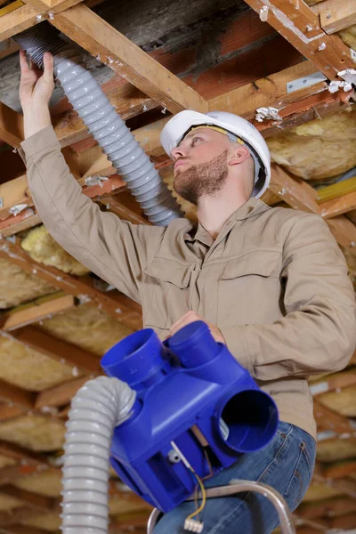 Man Contractor Installing Ventilation Hose Roof Space — Stock Photo, Image