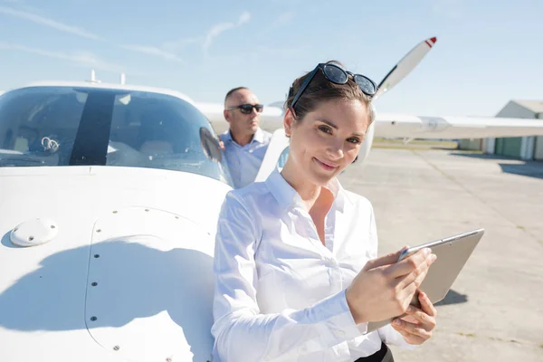 Woman Using Tablet Next Airplane — Stock Photo, Image